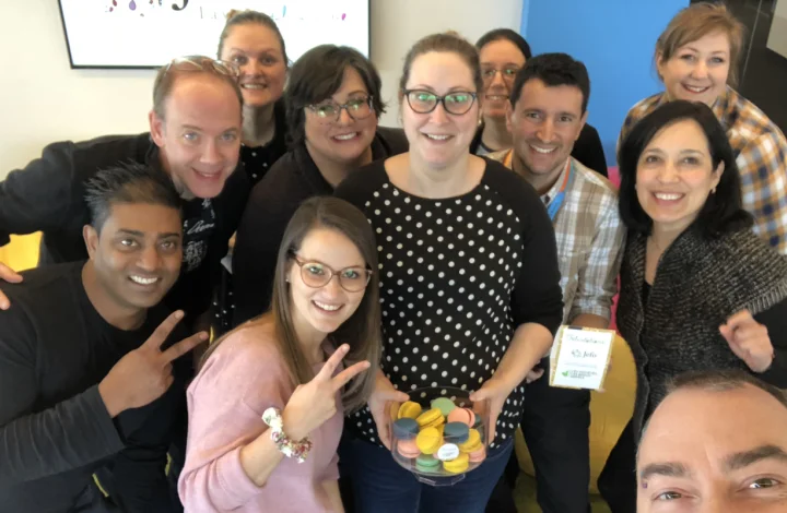 Jefo team celebrating 2019 Gold Standard – Canada’s Best Managed Companies, smiling with colorful macarons.