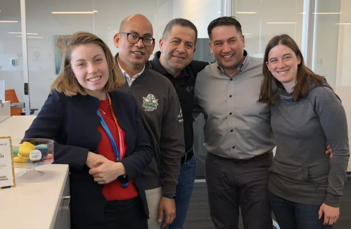 Jefo team celebrating 2019 Gold Standard – Canada’s Best Managed Companies, smiling with colorful macarons.
