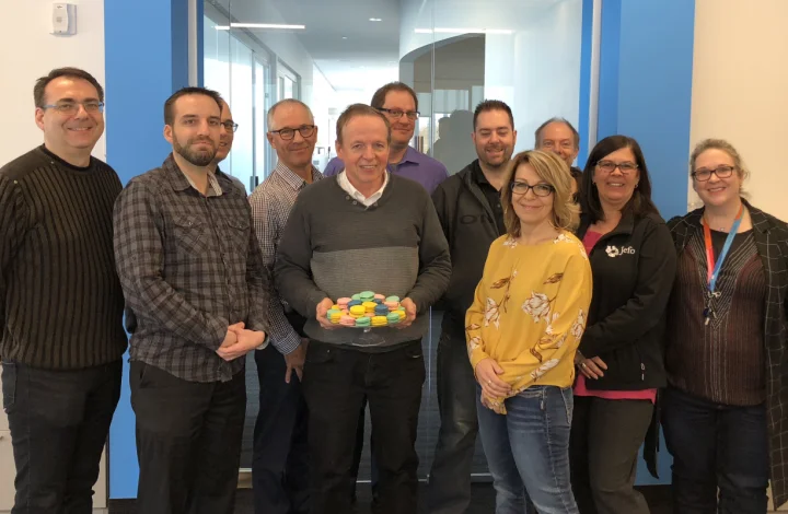 Jefo team celebrating 2019 Gold Standard – Canada’s Best Managed Companies, smiling with colorful macarons.