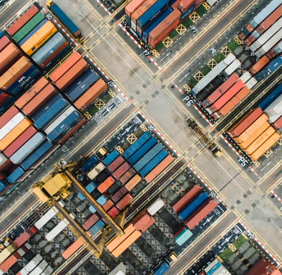 Aerial view of shipping containers illustrating Jefo’s global supply chain in animal nutrition.