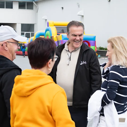 Friendly moment between colleagues at Jefo family day, reflecting a strong culture in animal nutrition.
