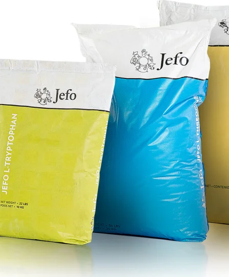 Colorful bags of Jefo L-Tryptophan and L-Threonine, essential amino acids for precision animal nutrition.